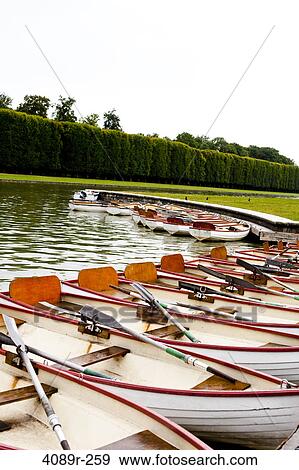 Stock Photo - Boats moored in a canal, Grand Canal, Chateau De Versailles, Versailles, Paris, Ile-De-France, France. Fotosearch