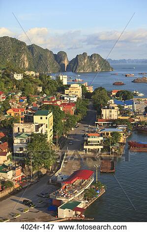 Stock Photo - Coastal city with cliffs viewed from Bai Chay Bridge, Halong Bay, Vietnam. Fotosearch