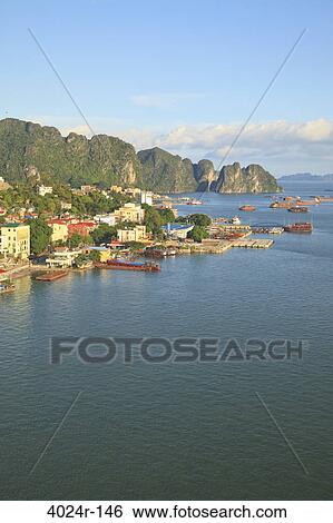 Coastal city with cliffs viewed from Bai Chay Bridge, Halong Bay, Vietnam View Large Photo Image Stock Photograph - Coastal city with cliffs viewed from Bai Chay Bridge, Halong Bay, Vietnam. Fotosearch