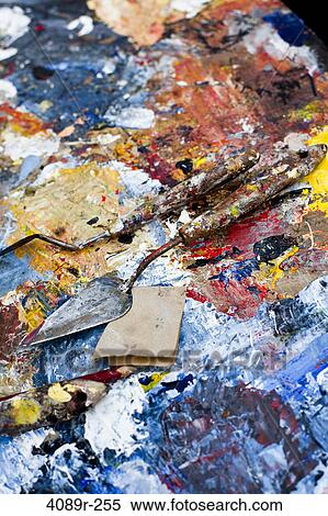 Stock Photography - Palette knives on a messy palette, Montmartre, Paris, Ile-De-France, France. Fotosearch
