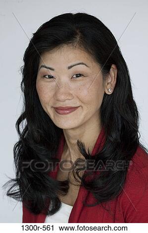 Stock Image - Portrait of a mid adult woman smiling. Fotosearch