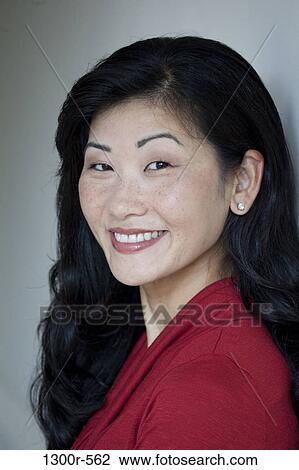 Portrait of a mid adult woman smiling View Large Photo Image Stock Image - Portrait of a mid adult woman smiling. Fotosearch