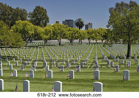 Tombstones in a cemetery with office towers of Westwood and Wilshire Boulevard in background, Los Angeles National Cemetery, Los Angeles, California, USA View Large Photo Image Stock Image - Tombstones in a cemetery with office towers of Westwood and Wilshire Boulevard in background, Los Angeles National Cemetery, Los Angeles, California, USA. Fotosearch
