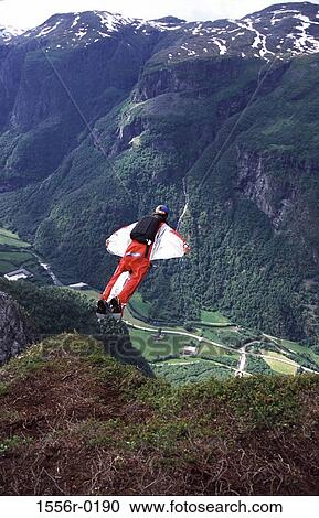 Base jumping, Hardavangar Fjord, Norway View Large Photo Image Stock Image - Base jumping, Hardavangar Fjord, Norway. Fotosearch