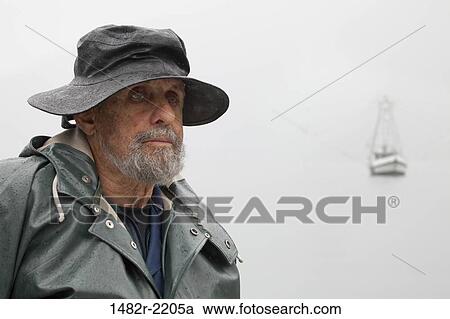 Stock Image - Close-up of a fisherman, Baranof Island, Alaska, USA. Fotosearch