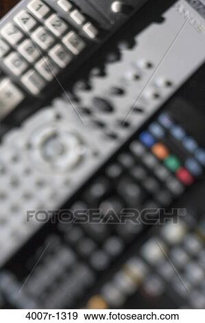 High angle view of remote controls View Large Photo Image Stock Photo - High angle view of remote controls. Fotosearch