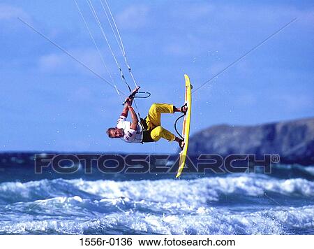 Stock Photograph - Kiteboarding, Watergate Bay, Cornwall, England. Fotosearch