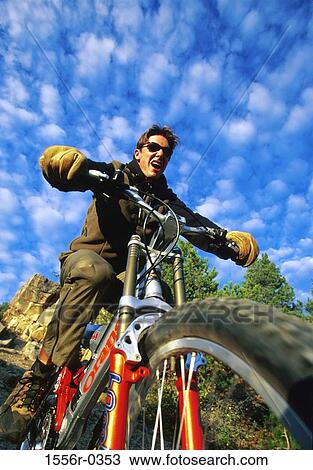 Stock Image - Man riding motorcycle. Fotosearch