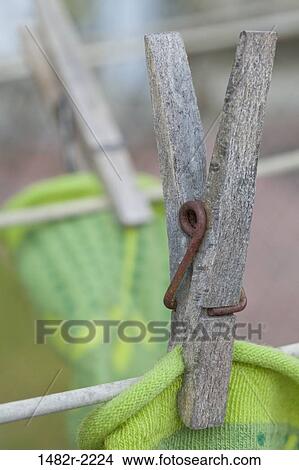 Old wooden clothes pin on clothes line, close-up View Large Photo Image Picture - Old wooden clothes pin on clothes line, close-up. Fotosearch