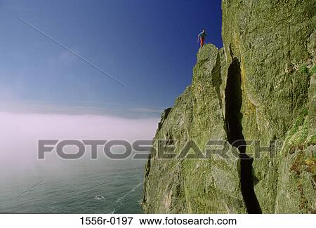 Person mountain climbing, Gogarth, Anglesey, Wales View Large Photo Image Stock Photo - Person mountain climbing, Gogarth, Anglesey, Wales. Fotosearch