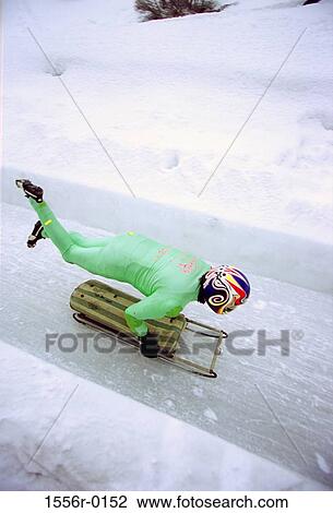 Stock Image - Person sledding, St. Moritz, Switzerland. Fotosearch