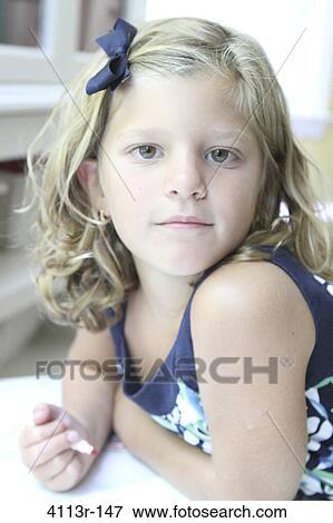 Portrait of a girl holding a felt tip pen and studying View Large Photo Image Stock Photo - Portrait of a girl holding a felt tip pen and studying. Fotosearch