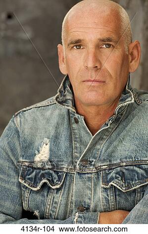 Picture - Portrait of a man with his arms crossed. Fotosearch