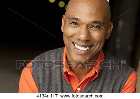 Portrait of young smiling man outdoors at night View Large Photo Image Stock Photo - Portrait of young smiling man outdoors at night. Fotosearch
