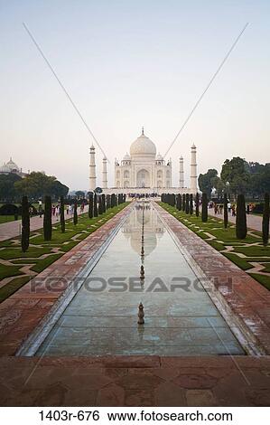 Reflection of a mausoleum in water, Taj Mahal, Agra, Uttar Pradesh, India View Large Photo Image Stock Photograph - Reflection of a mausoleum in water, Taj Mahal, Agra, Uttar Pradesh, India. Fotosearch