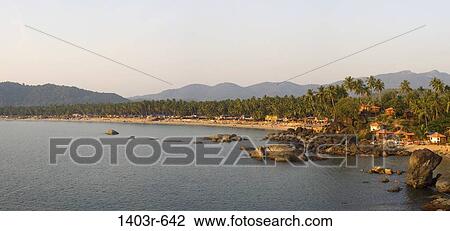 Stock Image - Rocks on the beach, Palolem Beach, Goa, India. Fotosearch