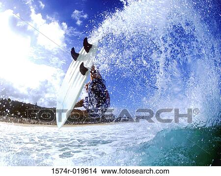 Side profile of a person surfing in the sea View Large Photo Image Picture - Side profile of a person surfing in the sea. Fotosearch