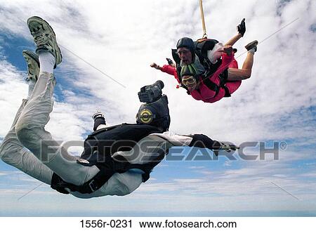 Three people skyding and being filmed View Large Photo Image Stock Image - Three people skyding and being filmed. Fotosearch