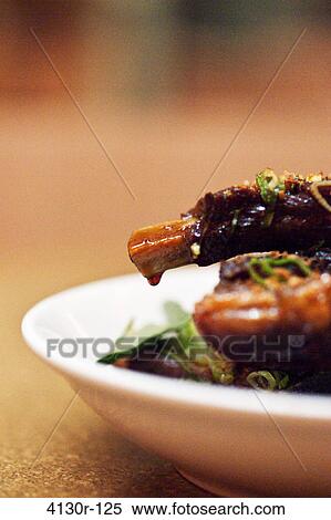 USA, New York City, Manhattan, close up of ribs with lemongrass and caramel View Large Photo Image Stock Photography - USA, New York City, Manhattan, close up of ribs with lemongrass and caramel. Fotosearch