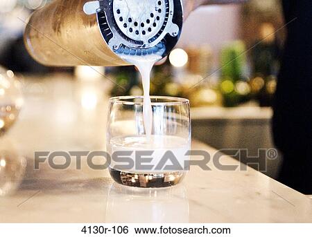 USA, New York City, Manhattan, pouring pisco sour from shaker to glass View Large Photo Image Stock Photograph - USA, New York City, Manhattan, pouring pisco sour from shaker to glass. Fotosearch