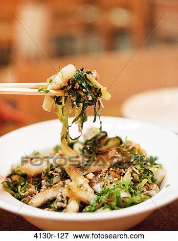 Stock Photo - USA, New York State, New York City, Brooklyn, Rice noodles with pork. Fotosearch