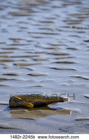 Stock Image - USA, Washington State, Hansville, Point No Point, Kitsap County, message in a bottle. Fotosearch