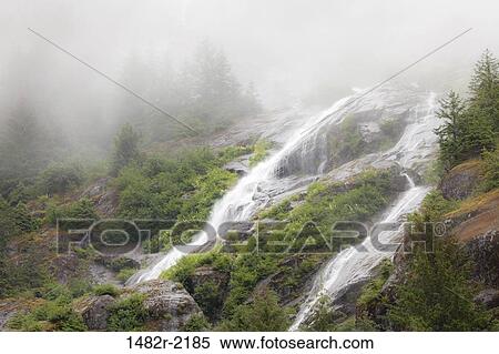 Stock Photography - Waterfalls in fog, Endicott Arm, Alaska, USA. Fotosearch