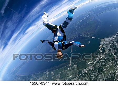 Young adult woman skydiving View Large Photo Image Picture - Young adult woman skydiving. Fotosearch