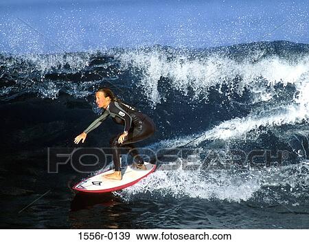 Young adult woman surfing, Lanzarote, Canary Islands View Large Photo Image Stock Photo - Young adult woman surfing, Lanzarote, Canary Islands. Fotosearch