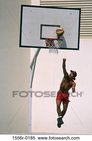 Young man playing basketball View Large Photo Image Stock Photography - Young man playing basketball. Fotosearch