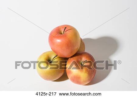 Organic Apples in pyramid on white background View Large Photo Image Stock Photo - Organic Apples in pyramid on white background. Fotosearch