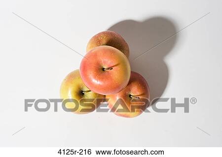 Organic Apples in pyramid on white background View Large Photo Image Stock Photograph - Organic Apples in pyramid on white background. Fotosearch