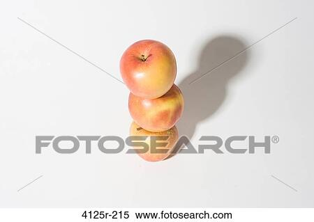 Organic empire apples stacked up balanced on white background View Large Photo Image Stock Photography - Organic empire apples stacked up balanced on white background. Fotosearch