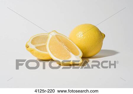 Organic lemons whole and sliced on white background View Large Photo Image Stock Image - Organic lemons whole and sliced on white background. Fotosearch