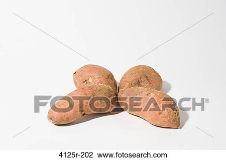 Organic Sweet Potato Yams in clover shape on white background View Large Photo Image Stock Image - Organic Sweet Potato Yams in clover shape on white background. Fotosearch