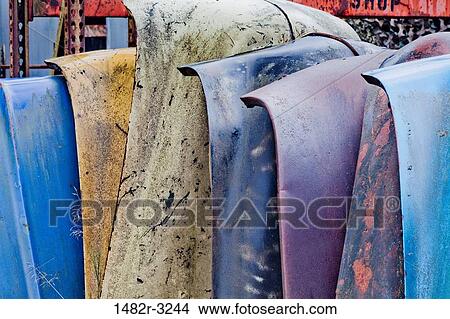 Stacked car hoods in wrecking yard View Large Photo Image Picture - Stacked car hoods in wrecking yard. Fotosearch
