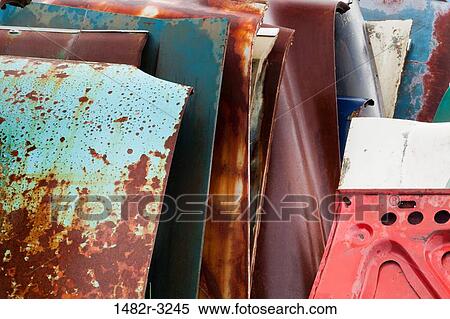 Stacked car hoods in wrecking yard View Large Photo Image Stock Photography - Stacked car hoods in wrecking yard. Fotosearch