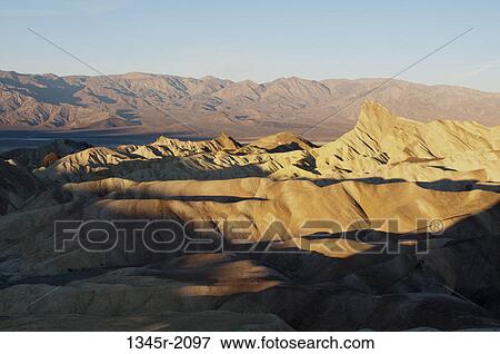 Stock Photo - USA, California, Death Valley National Park, Zabriskie Point in sunlight. Fotosearch