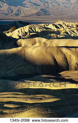 Stock Photo - USA, California, Death Valley National Park, Zabriskie Point in sunlight. Fotosearch