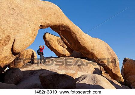 USA, California, Joshua Tree National Park, Woman under Arch Rock View Large Photo Image Stock Image - USA, California, Joshua Tree National Park, Woman under Arch Rock. Fotosearch