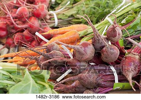 Stock Photograph - USA, California, La Jolla Farmer's Market, Organic beets and carrots. Fotosearch
