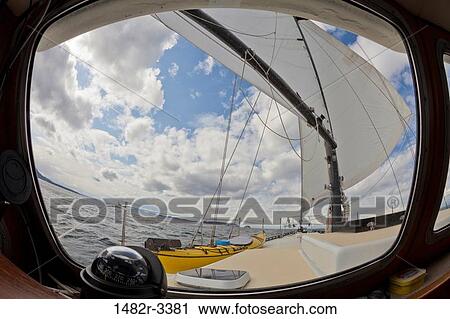 Stock Image - USA, Washington State, San Juan Islands, Part of sailing boat with sea in background. Fotosearch