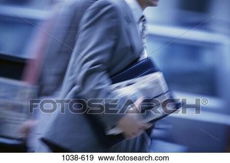 Stock Photo - blur, rush, business, outdoors, speed. Fotosearch