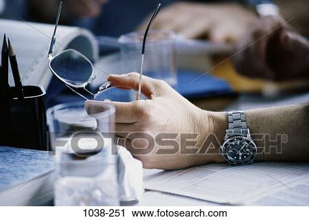 Stock Image - desk, eyeglasses, stress, business, concepts, challenges, chaotic. Fotosearch