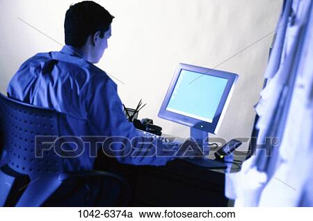 desk, monitor, concentration, papers, blue, computer View Large Photo Image Stock Image - desk, monitor, concentration, papers, blue, computer. Fotosearch