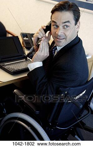 Stock Image - desk, telephone, busy, computer, laptop, phone. Fotosearch