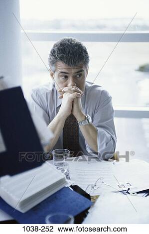 Stock Image - desk, watch, business, Middle-aged, watching, contemplation. Fotosearch