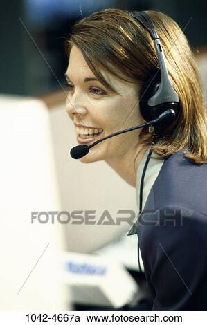 desk, woman, headset, smiling, telephone, talking, conversation View Large Photo Image Stock Image - desk, woman, headset, smiling, telephone, talking, conversation. Fotosearch