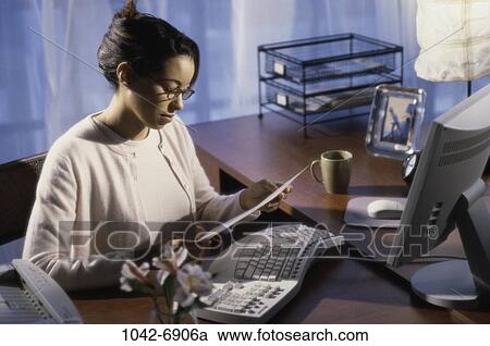 desk, woman, paperwork, computer, reading, business View Large Photo Image Stock Image - desk, woman, paperwork, computer, reading, business. Fotosearch
