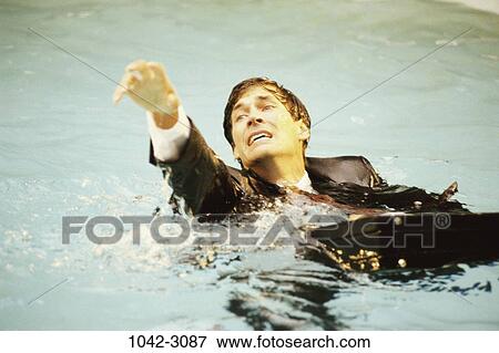drowning, briefcase, splash, business, outdoors View Large Photo Image Stock Photo - drowning, briefcase, splash, business, outdoors. Fotosearch